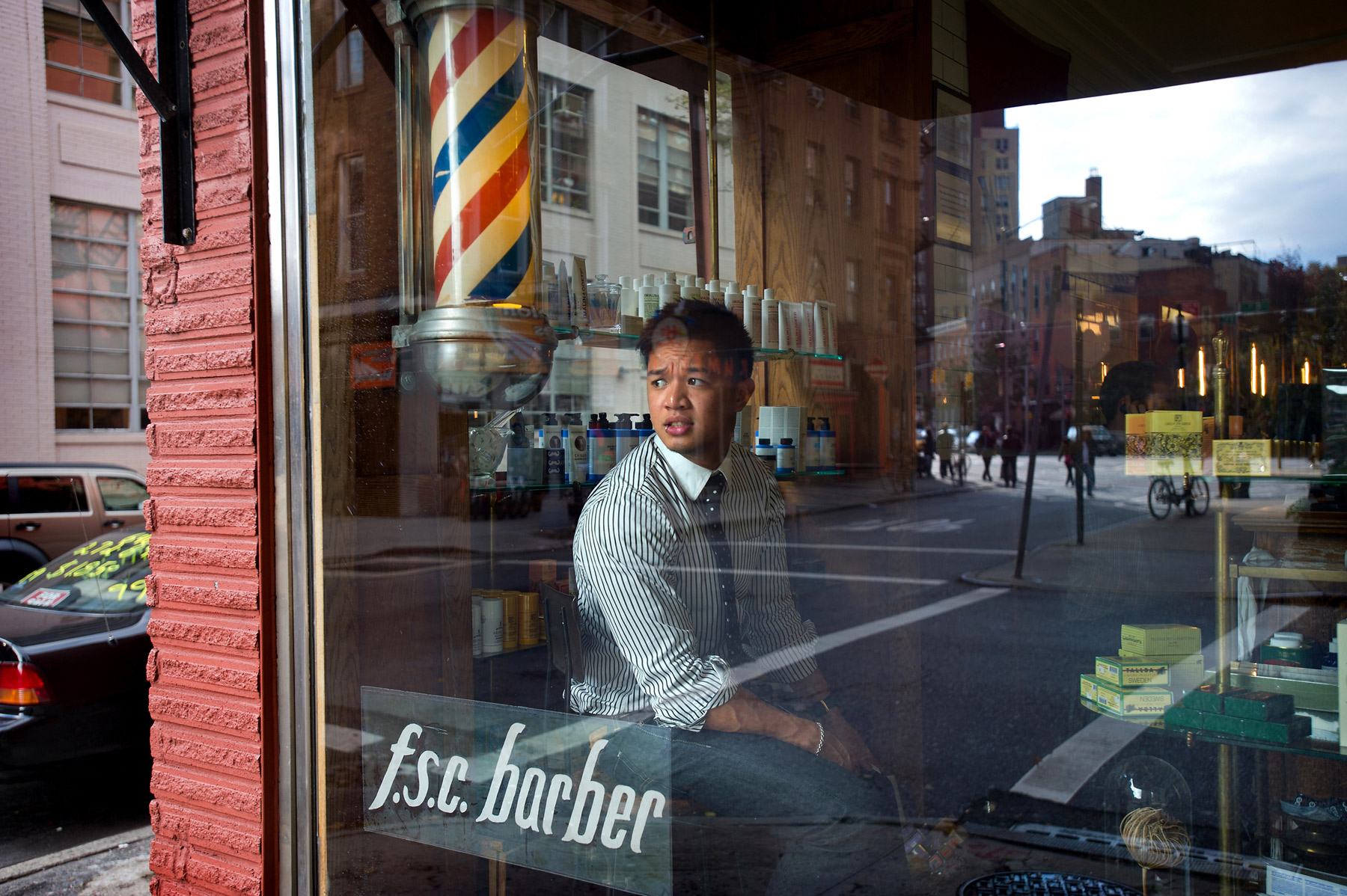 JoshuaBright_NewYorkTimes_Barbershop_lookingthroughwindow